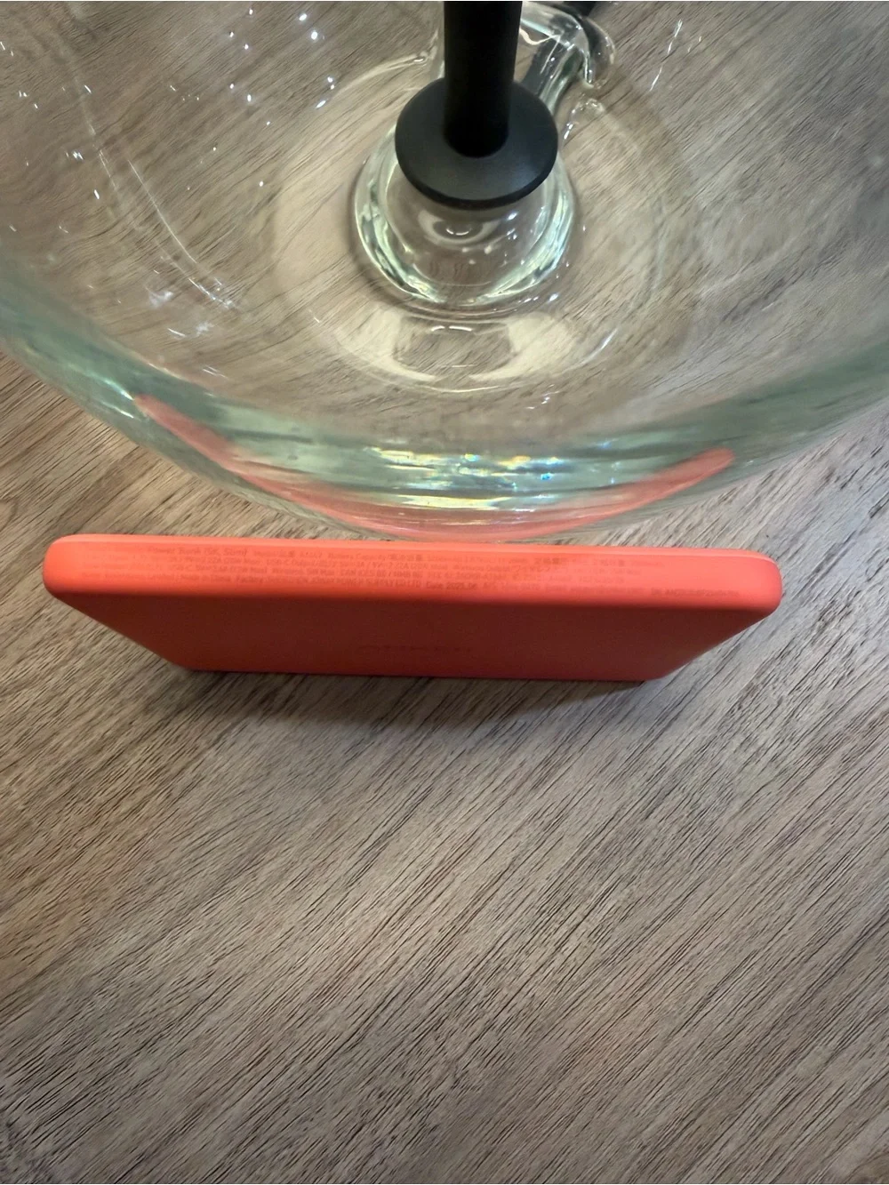 Anker Coral Orange Power Bank, Satechi Magnetic Wallet Stand, and Pop Socket